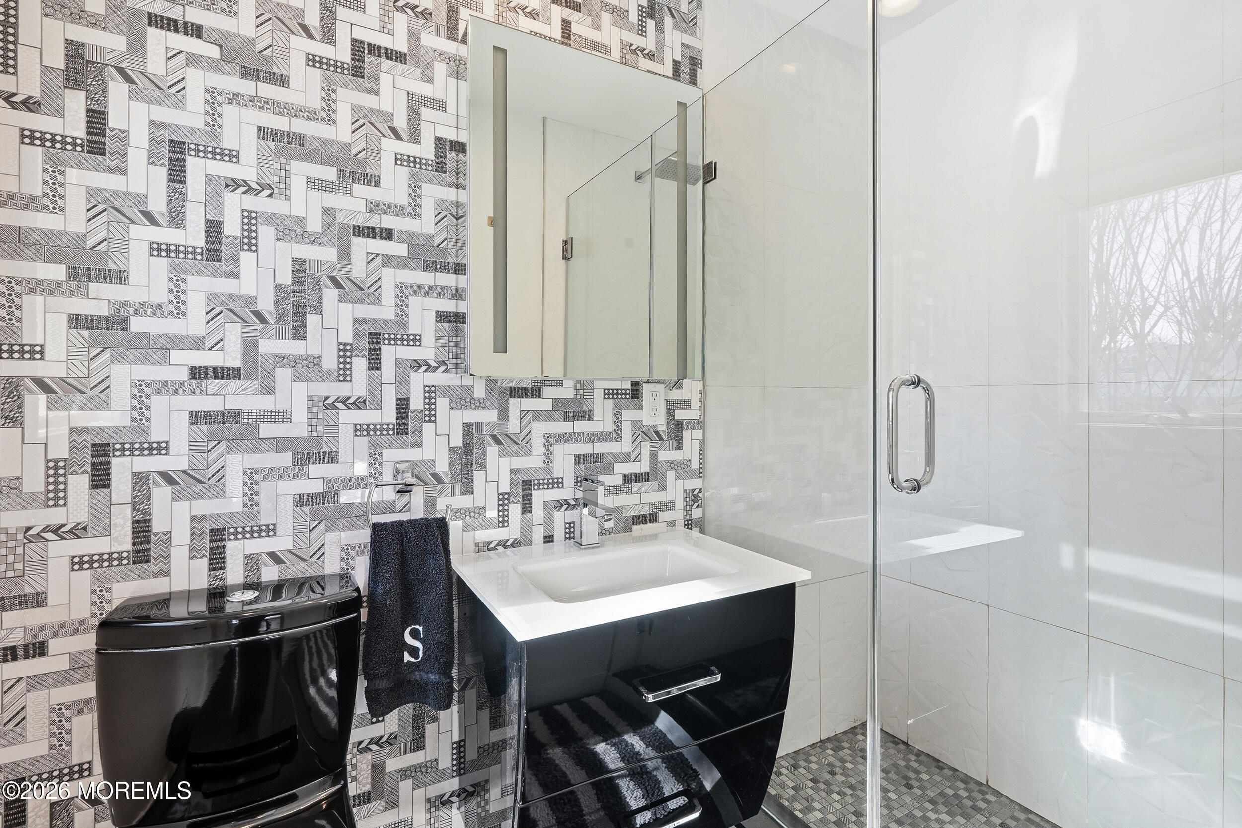 107 Grant Avenue Deal, NJ 07723 - Photo 23 of 38 a bathroom with a sink a toilet and shower