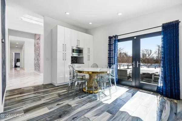 a view of a living room and dining room