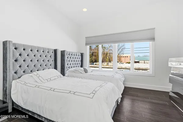 a large white bed in a white room