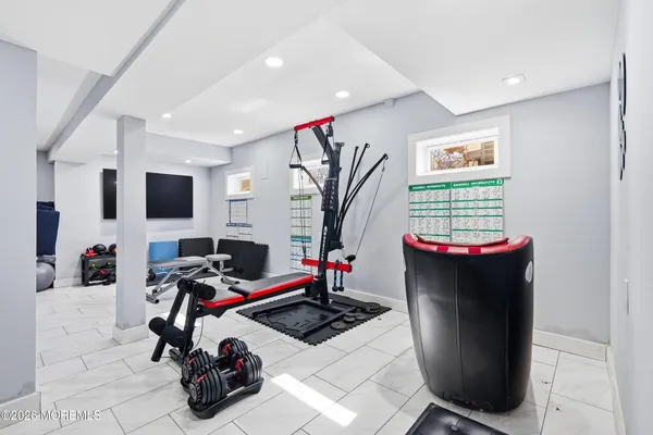 a room with furniture a flat screen tv and a fireplace