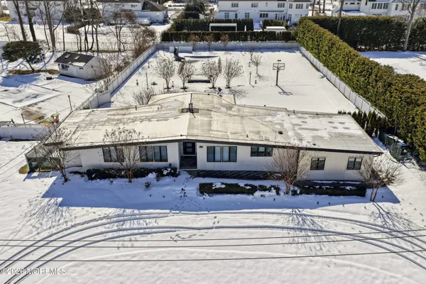 an aerial view of a house with a outdoor space