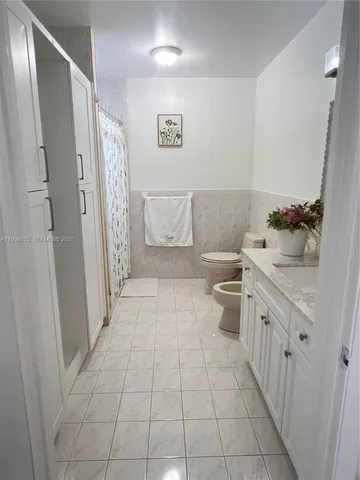 a bedroom with a bed and a mirror