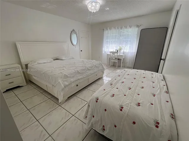 a kitchen with a sink a stove a microwave and cabinets