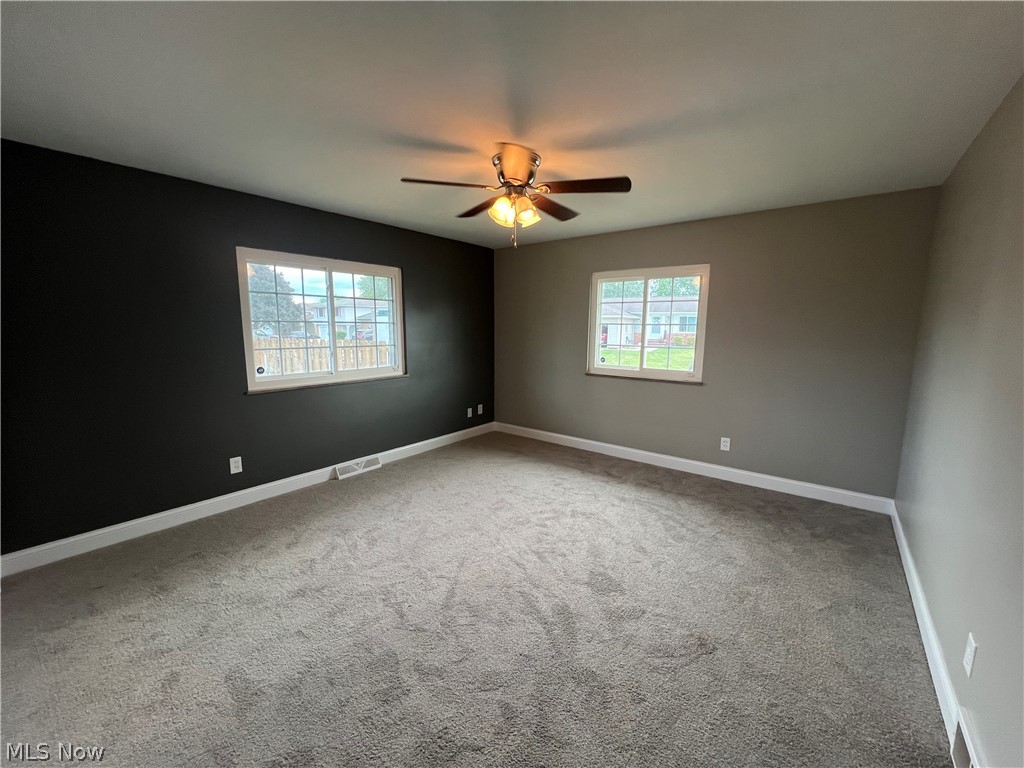 7475 Selwick Drive Parma, OH 44129 - Photo 18 of 29 Spare room with ceiling fan and carpet floors