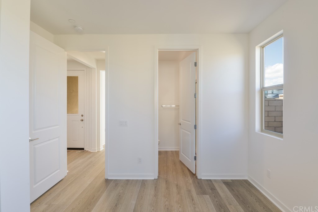 32318 Sonder Way Temecula, CA 92591 - Photo 11 of 18 a view of a room with wooden floor and a bathroom