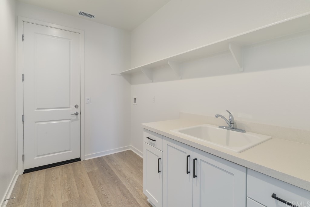 32318 Sonder Way Temecula, CA 92591 - Photo 7 of 18 a bathroom with a sink and vanity