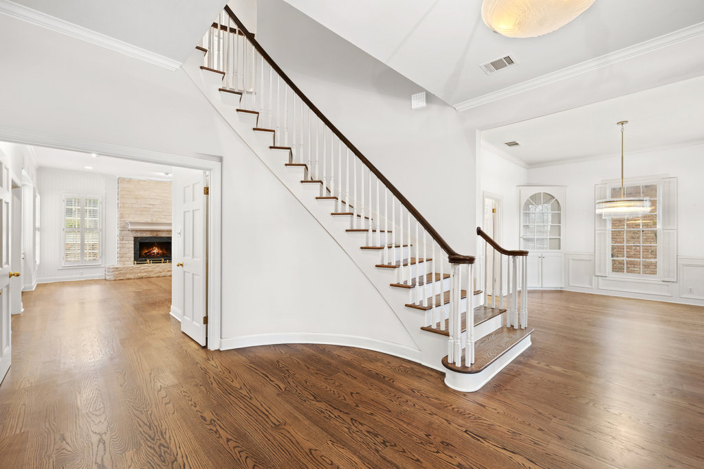 4 Rock Way Cove Austin, TX 78746 - Photo 15 of 26 a view of entryway with wooden floor and stairs
