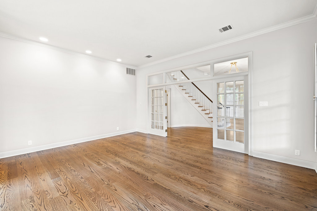 4 Rock Way Cove Austin, TX 78746 - Photo 16 of 26 a view of an empty room with wooden floor and stairs