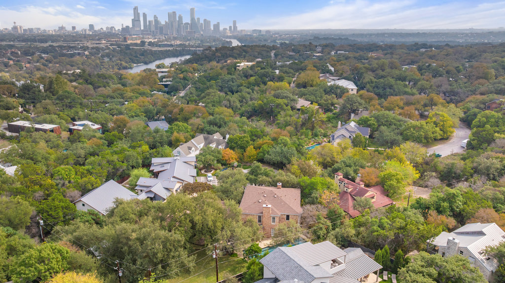 4 Rock Way Cove Austin, TX 78746 - Photo 2 of 26 an aerial view of a city with lots of residential buildings