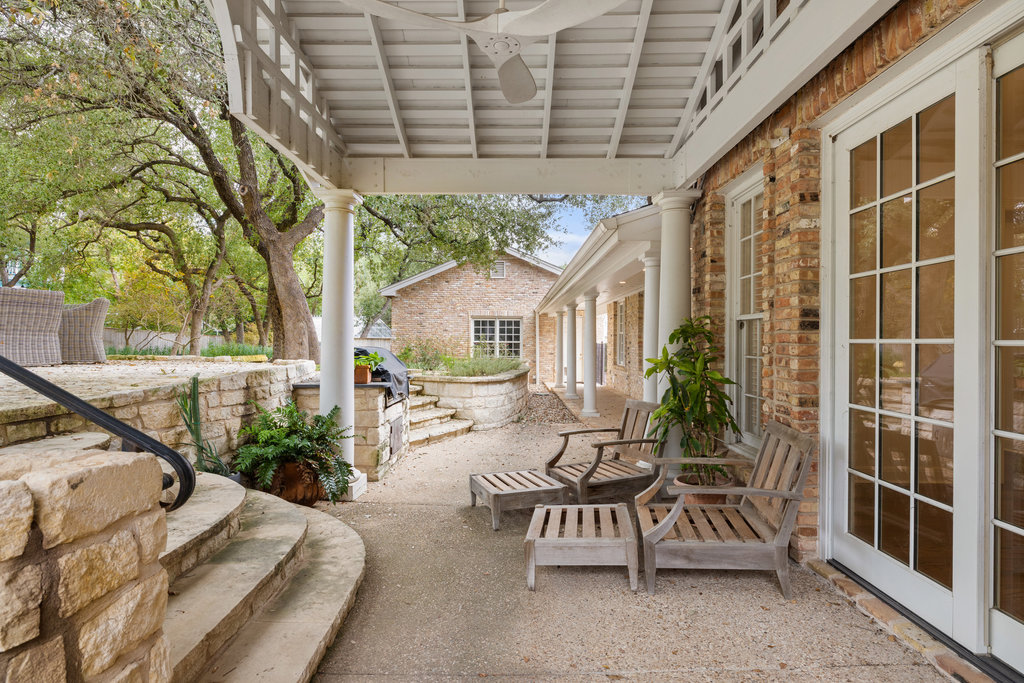 4 Rock Way Cove Austin, TX 78746 - Photo 21 of 26 a view of house with backyard and outdoor seating