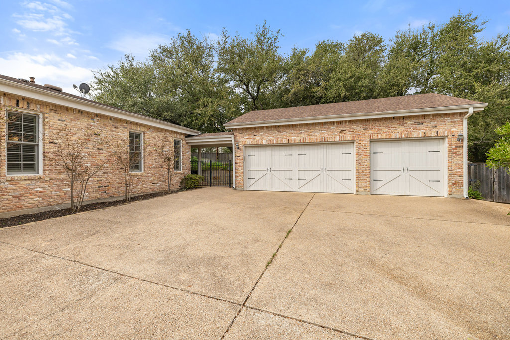 4 Rock Way Cove Austin, TX 78746 - Photo 26 of 26 a front view of a house with a garage