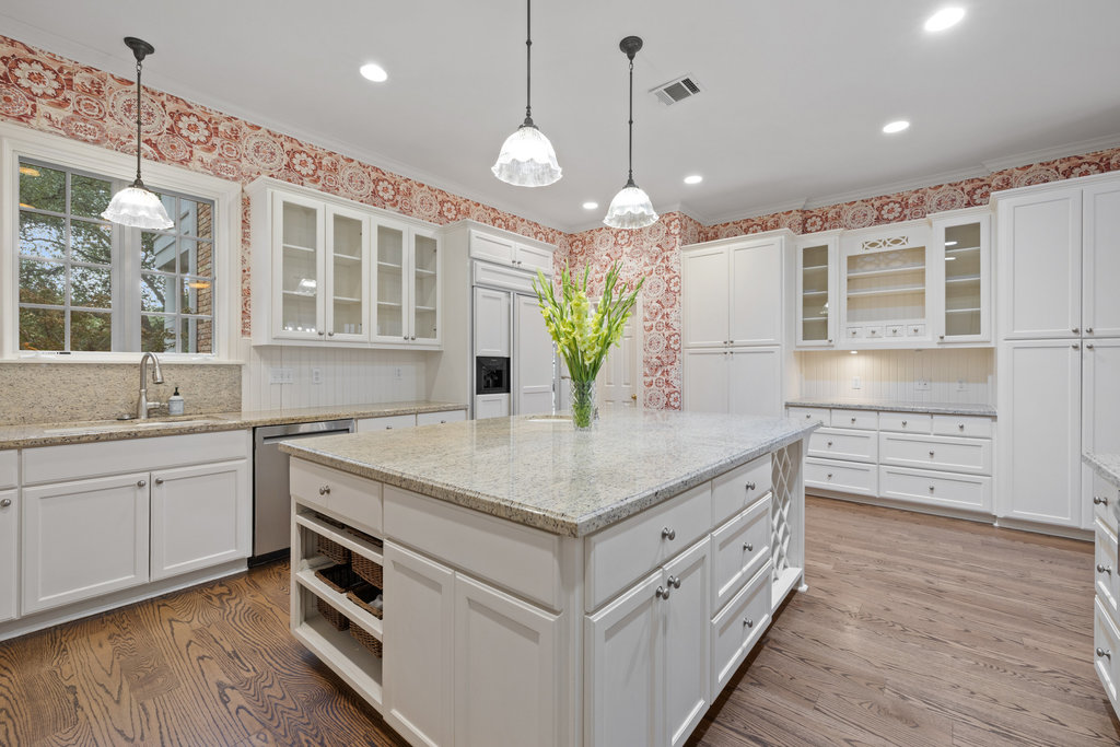 4 Rock Way Cove Austin, TX 78746 - Photo 8 of 26 a kitchen with stainless steel appliances granite countertop a kitchen island hardwood floor sink and stove