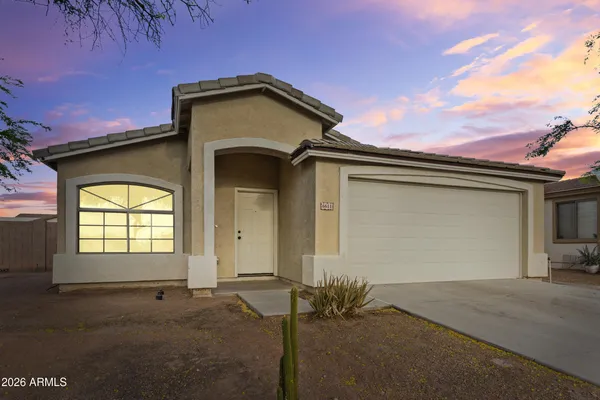 a front view of a house with a garage