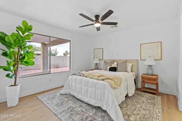 a bedroom with a bed and window
