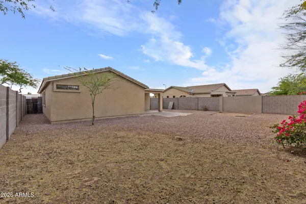 an aerial view of a house with a yard