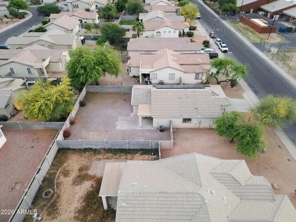 an aerial view of residential houses with outdoor space