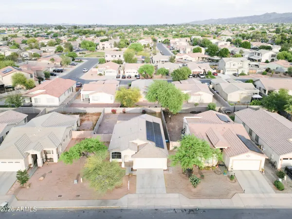 an aerial view of residential houses with outdoor space