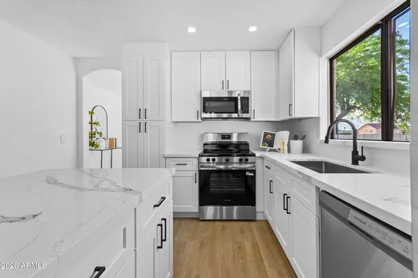 a view of living room with furniture and window