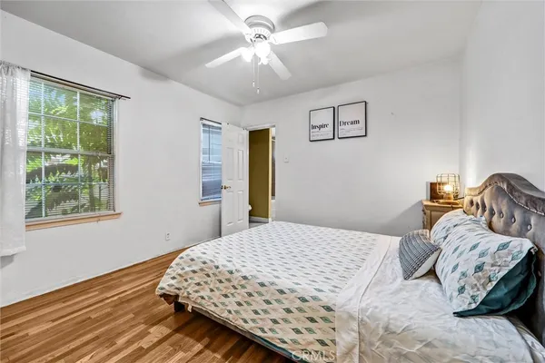 a bedroom with a bed and a television