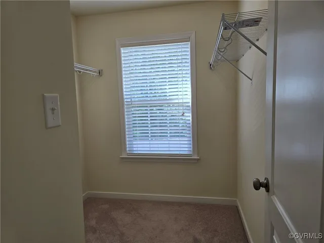 a bathroom with a shower and a window