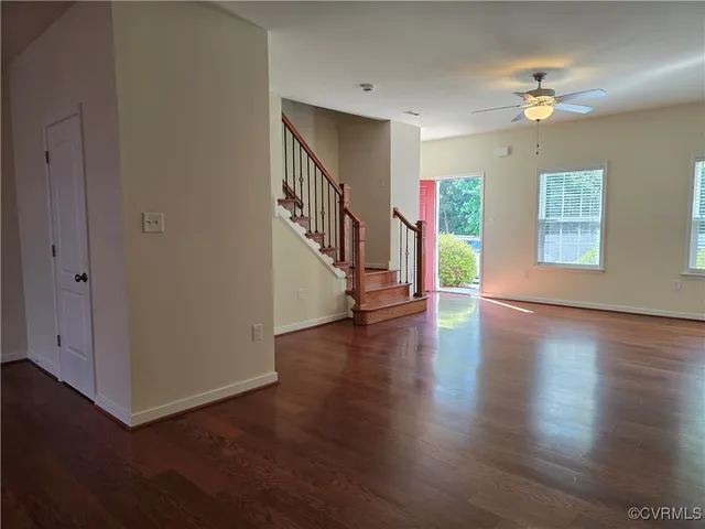a view of an entryway with wooden floor