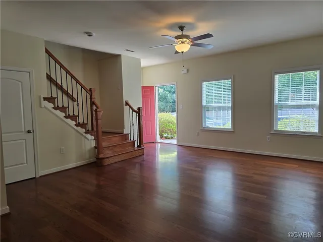 a view of an entryway with wooden floor
