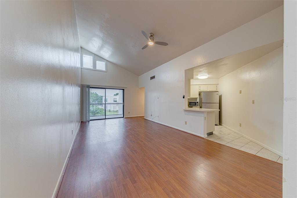 4004 Atrium Drive, Unit 4 Orlando, FL 32822 - Photo 5 of 24 a view of a kitchen and wooden floor