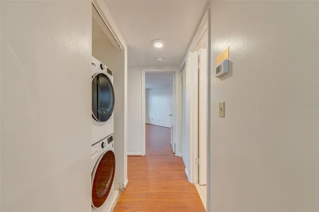 a view of a hallway with washer and dryer