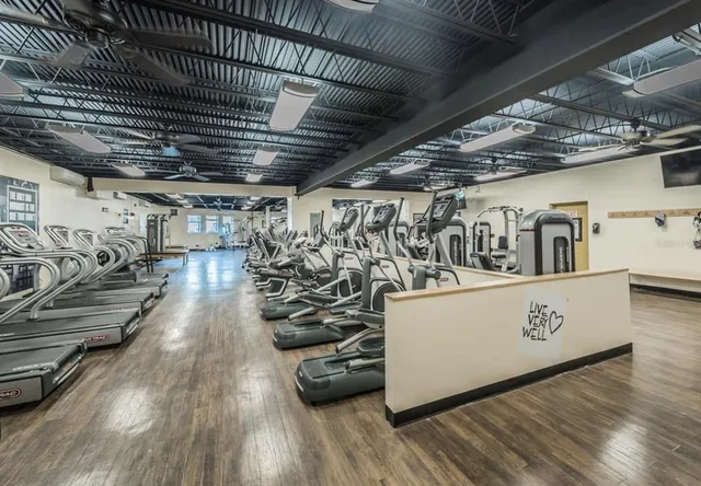 a view of a room with wooden floors