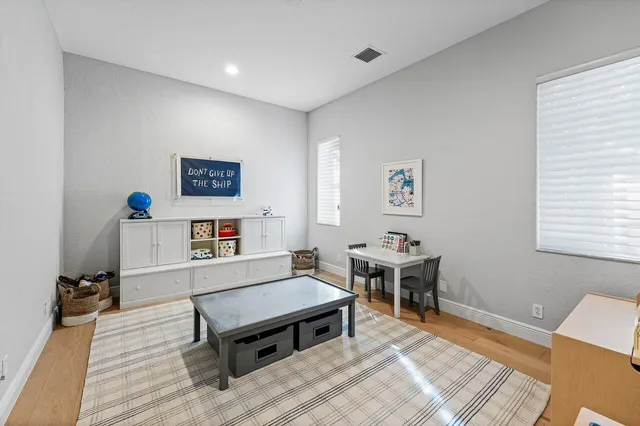 a spacious bedroom with a bed and a couch