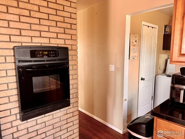 a kitchen with a stove and a refrigerator