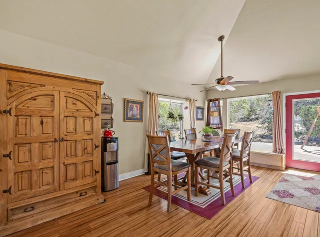 a view of a dining room with furniture window and wooden floor