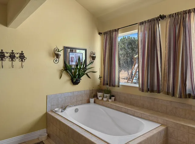 a bathroom with a bathtub and a sink