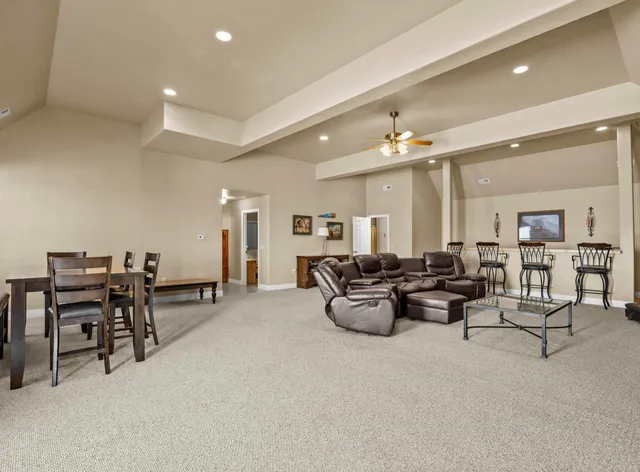 a living room with furniture and white walls