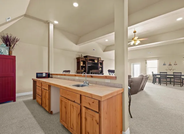 a kitchen with stainless steel appliances granite countertop a sink and cabinets