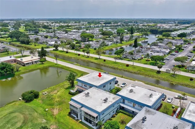 an aerial view of a house with a lake view