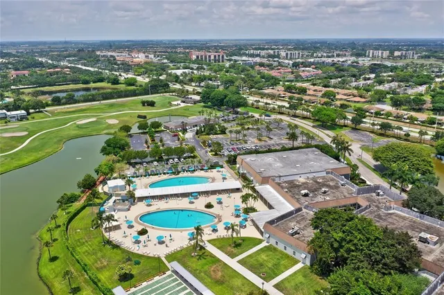 an aerial view of a house with a lake view