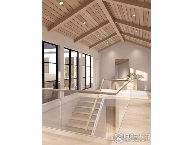 a room with a bed and a large window