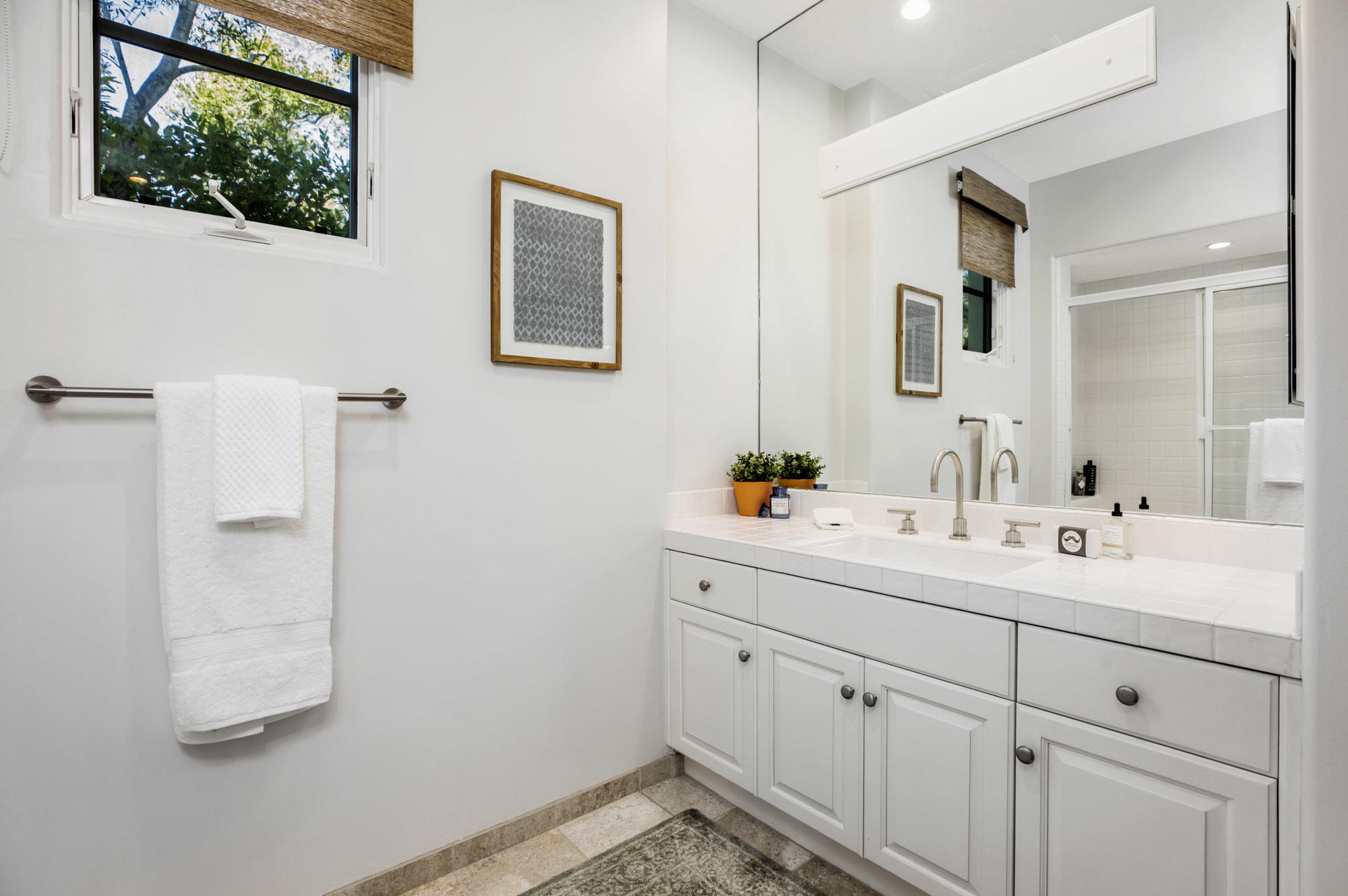 485 Monarch Lane Santa Barbara, CA 93108 - Photo 14 of 24 a bathroom with a sink and a mirror