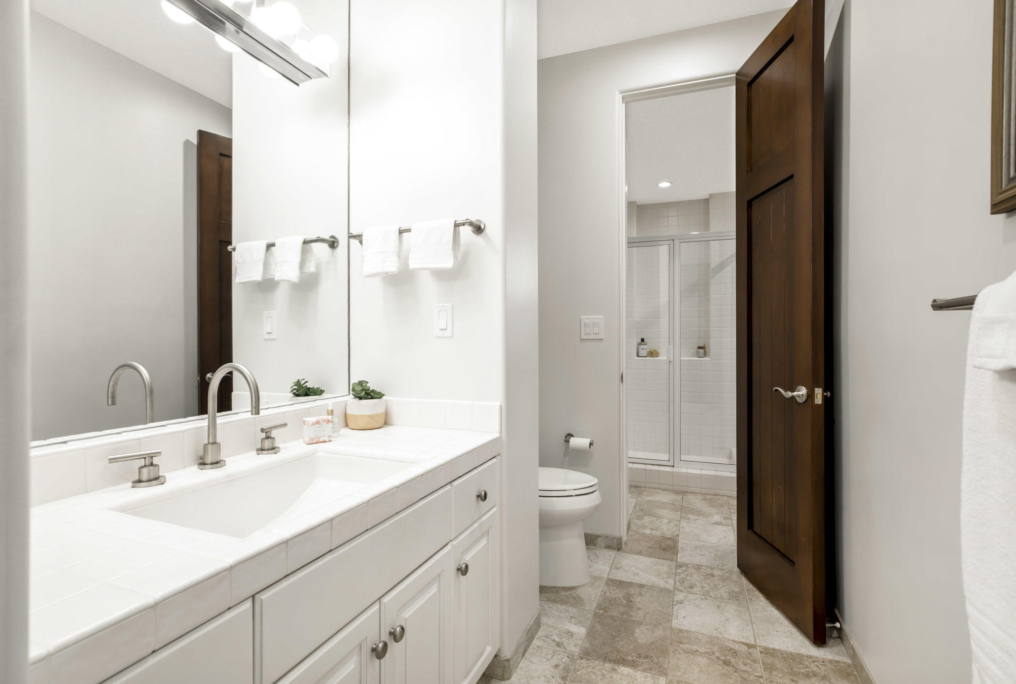 485 Monarch Lane Santa Barbara, CA 93108 - Photo 18 of 24 a bathroom with a double vanity sink toilet and shower