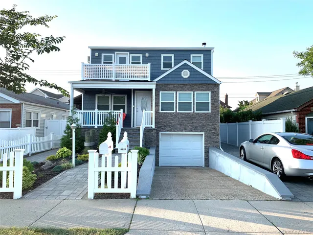 a front view of a house with a patio