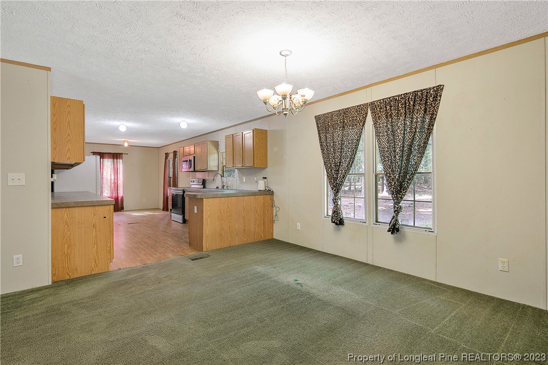 4759 Darroch Road Lillington, NC 27546 - Photo 11 of 50 a view of a kitchen with a sink cabinet and a window
