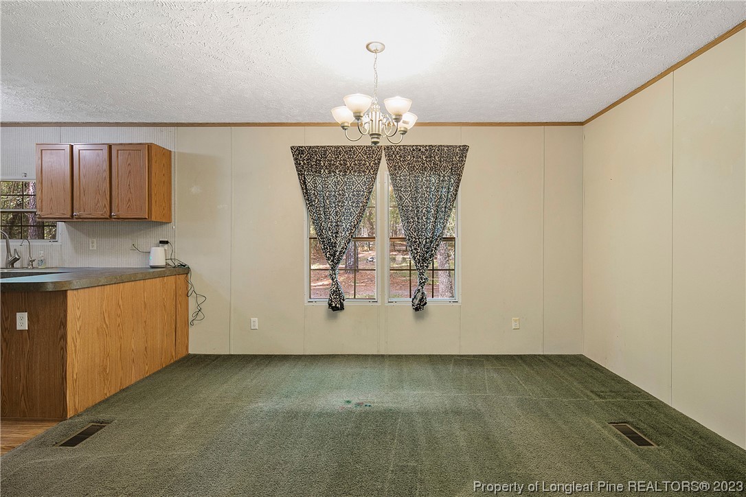 4759 Darroch Road Lillington, NC 27546 - Photo 12 of 50 a view of kitchen with refrigerator and window