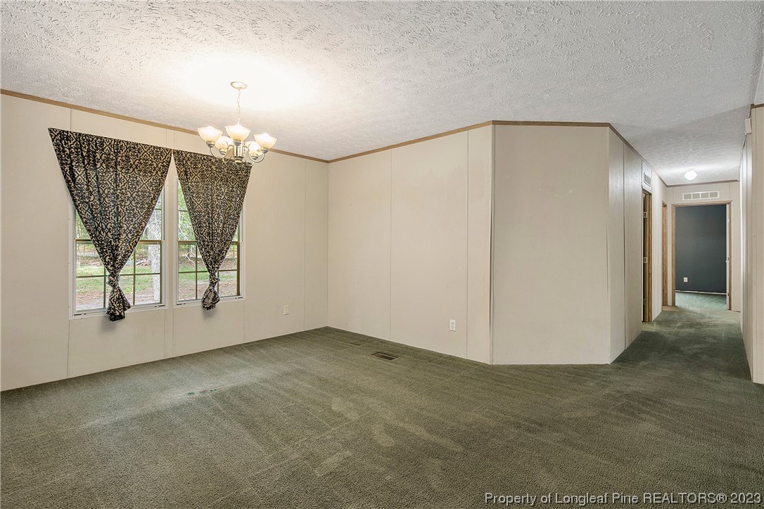 4759 Darroch Road Lillington, NC 27546 - Photo 13 of 50 an empty room with windows and entryway