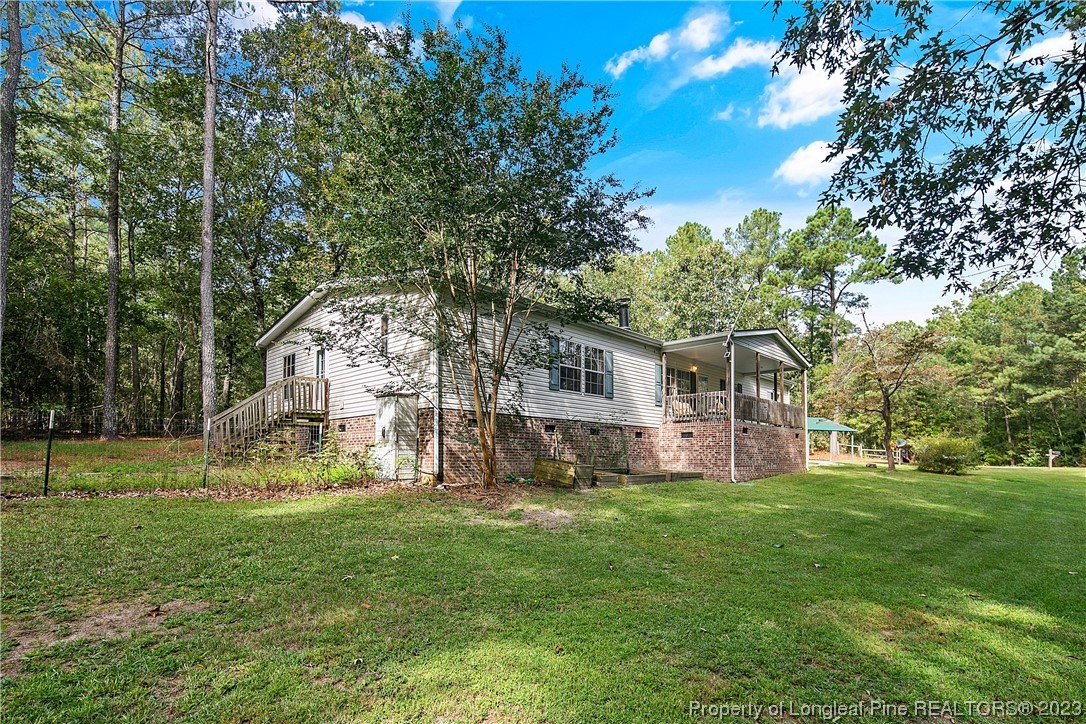 4759 Darroch Road Lillington, NC 27546 - Photo 2 of 50 a view of a house with a yard