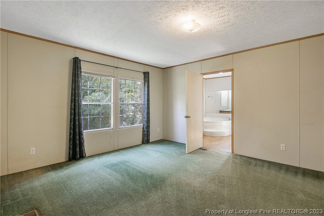 4759 Darroch Road Lillington, NC 27546 - Photo 23 of 50 a view of an empty room with a window