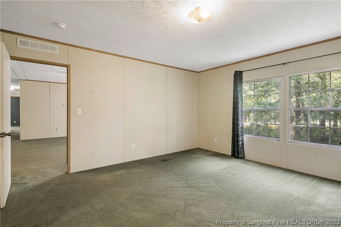 4759 Darroch Road Lillington, NC 27546 - Photo 26 of 50 an empty room with windows