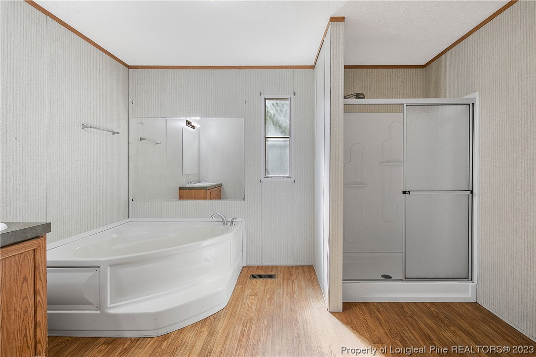 4759 Darroch Road Lillington, NC 27546 - Photo 27 of 50 a bathroom with a bathtub and a shower