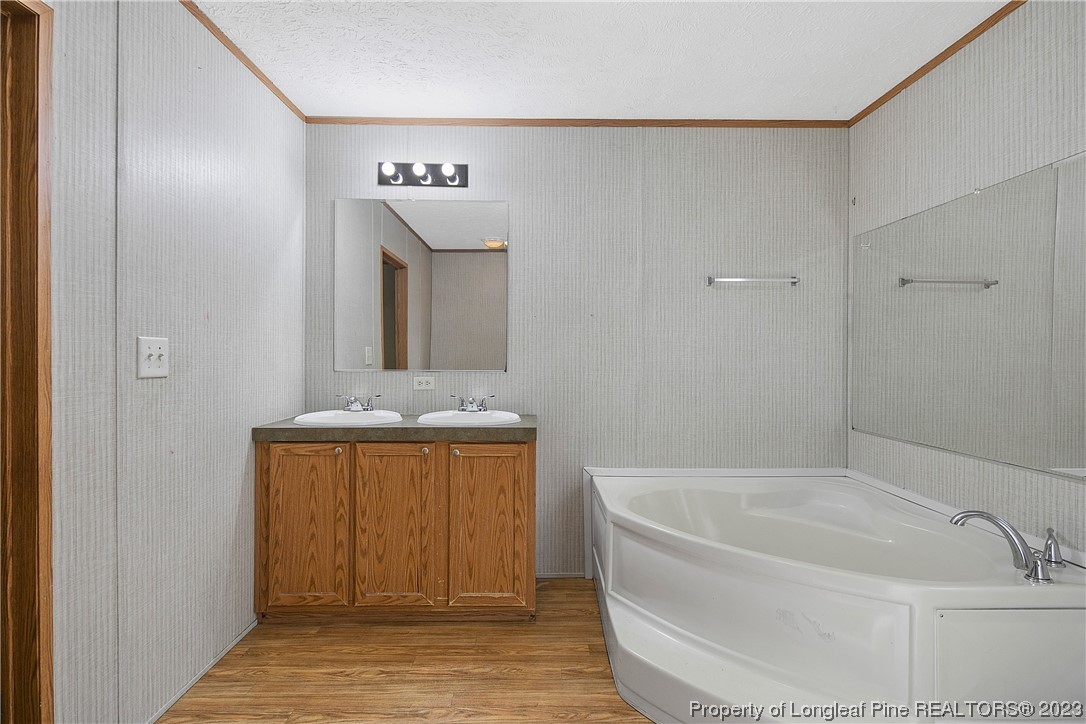 4759 Darroch Road Lillington, NC 27546 - Photo 28 of 50 a bathroom with a bathtub and shower