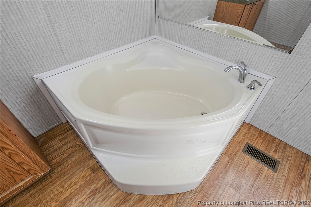 4759 Darroch Road Lillington, NC 27546 - Photo 29 of 50 a white bath tub sitting in a bathroom